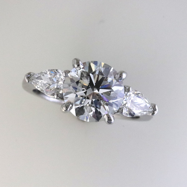 Engagement ring 2 carat round pear shaped diamond sides 1